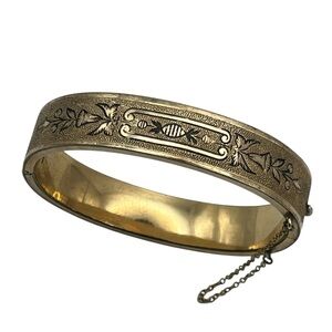 Antique Victorian gold tone black enamel flower design hinged bangle bracelet